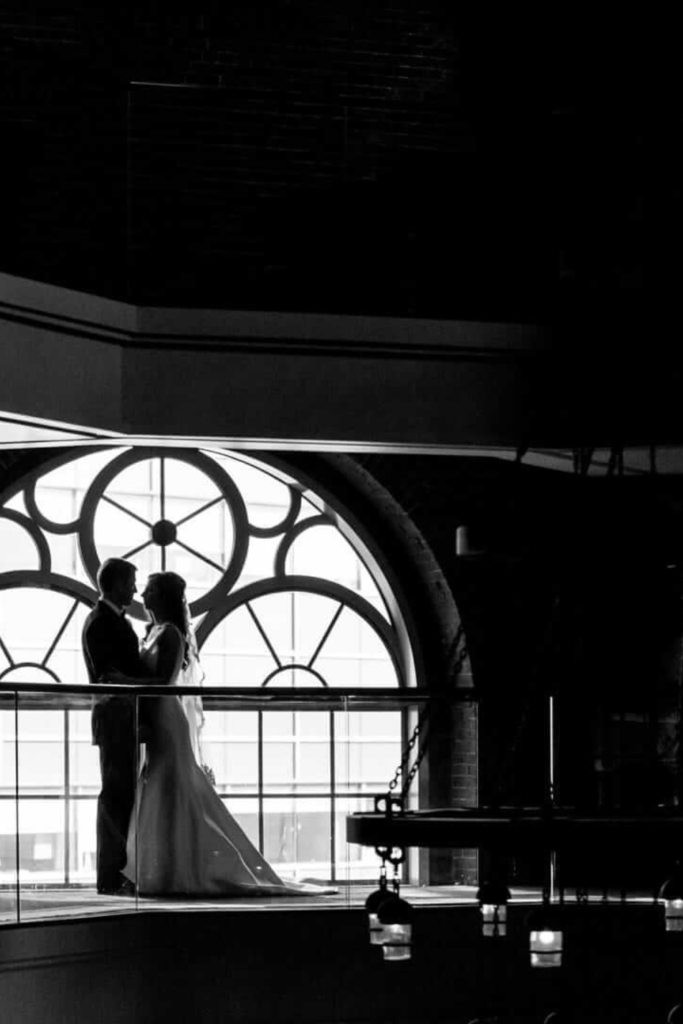 Black and white photo of couple at winter holiday wedding